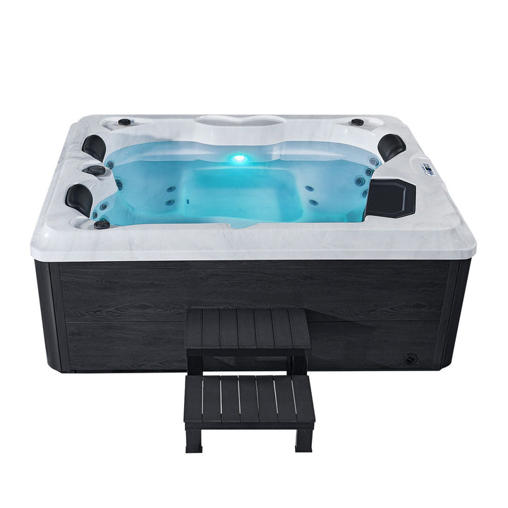 Oasis de bain à remous extérieur avec marches 